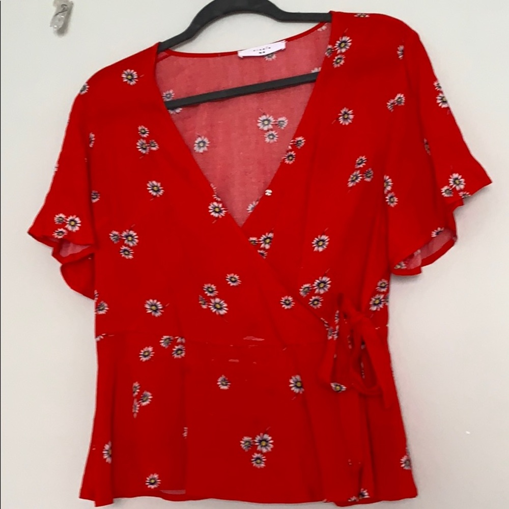 Red floral top.